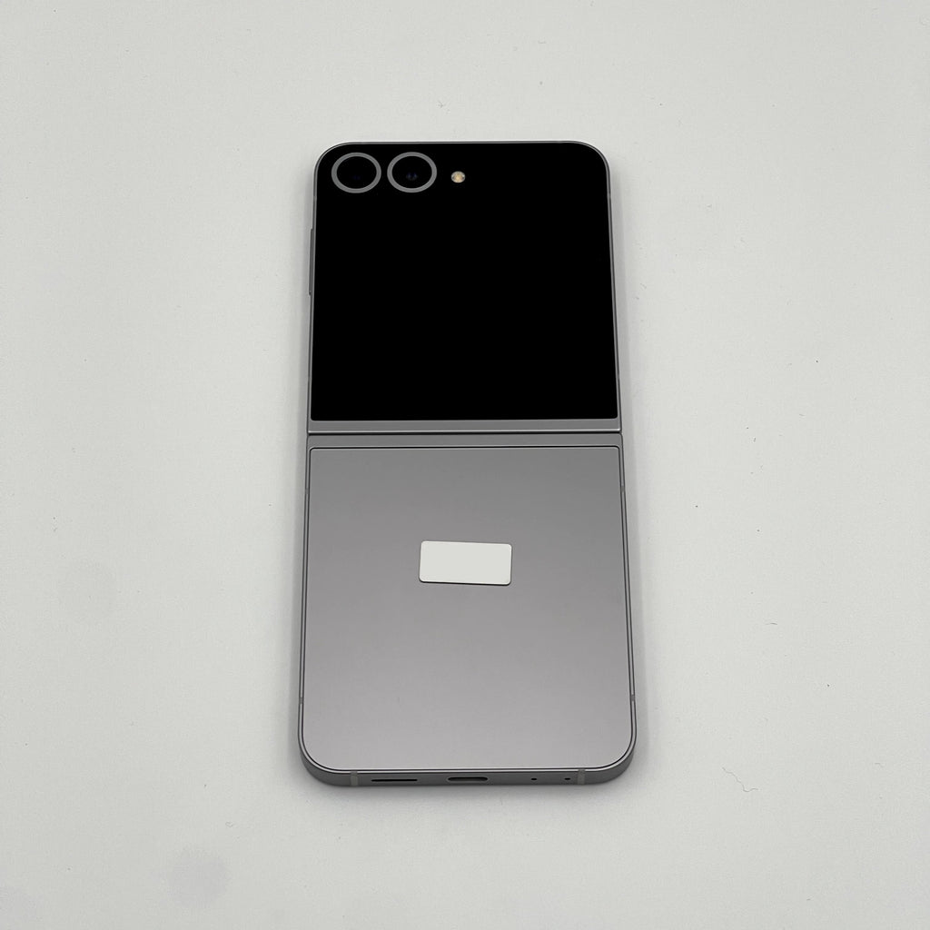 Smartphone with a reflective screen on a light gray background